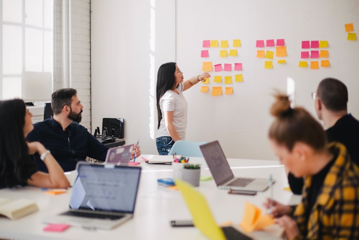 Volunteers planning a community AI education program around a table