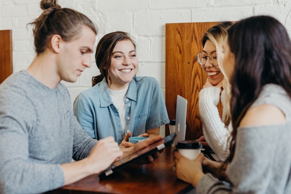 Diverse students learning AI fundamentals together at a community session